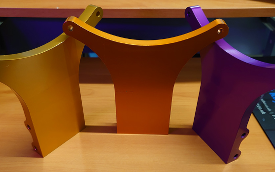 This picture shows our Rear Shock Tower parts for the Aowei Yamabuggy, shown in purple, gold and orange.